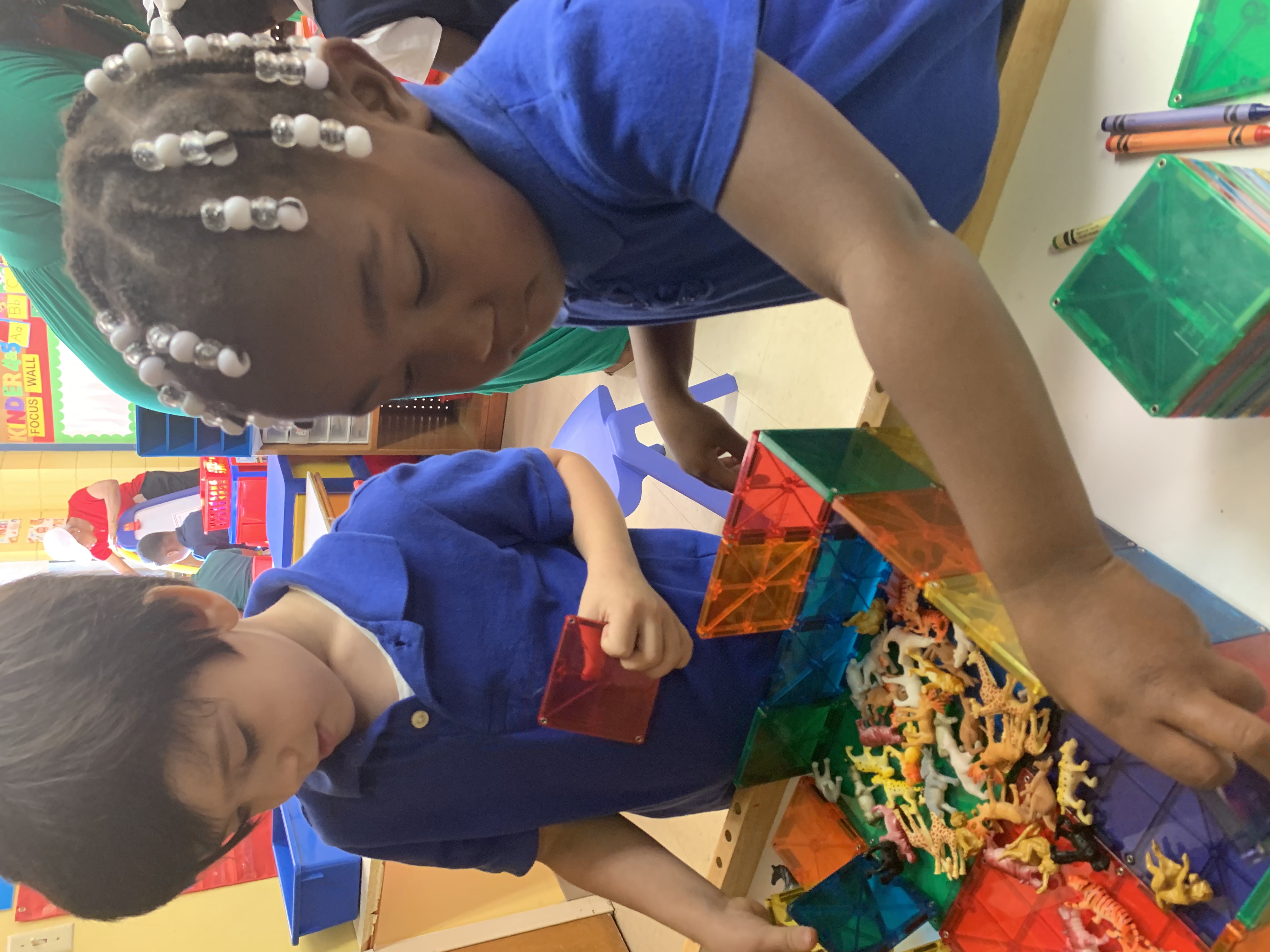 A parent and child arriving happily at the childcare center