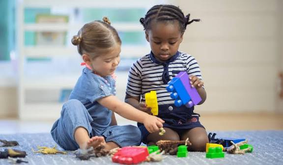 Pre-K children practicing writing and counting